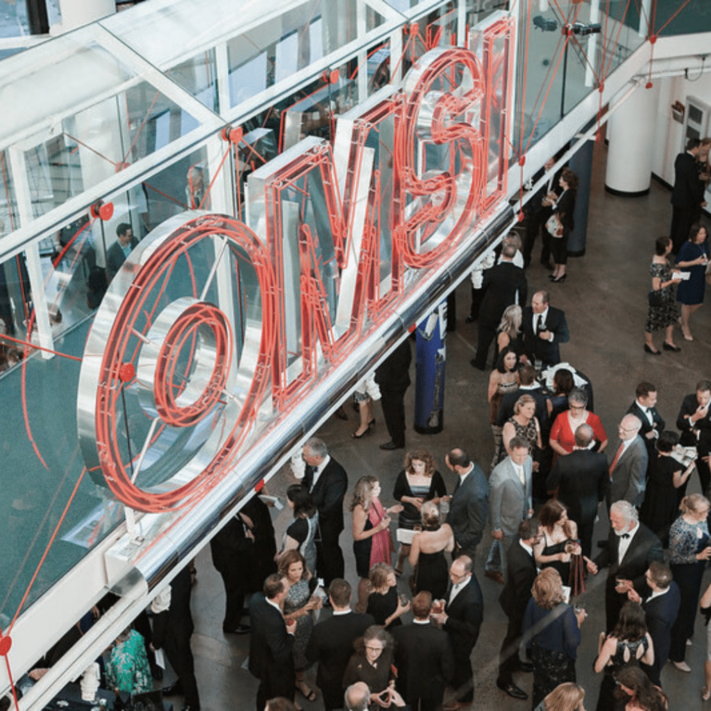 view of OMSI gala attendees from above in the OMSI lobby